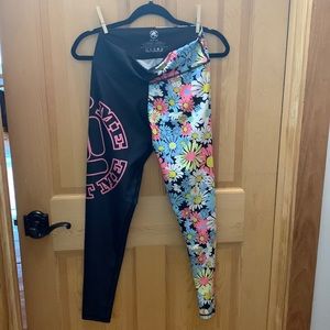 NWOT. Feed Me Fight Me Leggings. Medium.